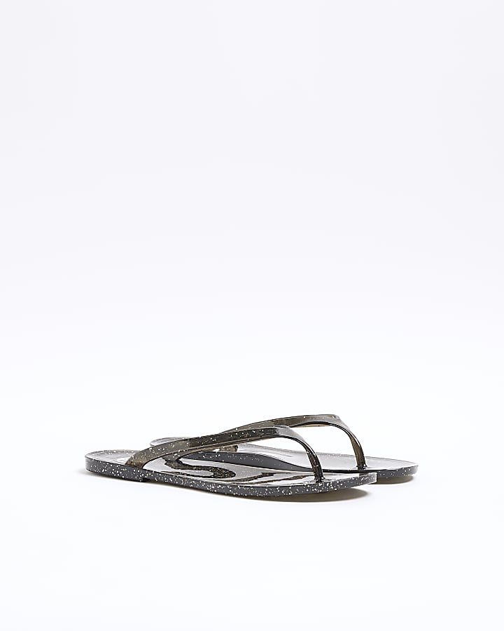 Black metallic jelly flip flop sandals