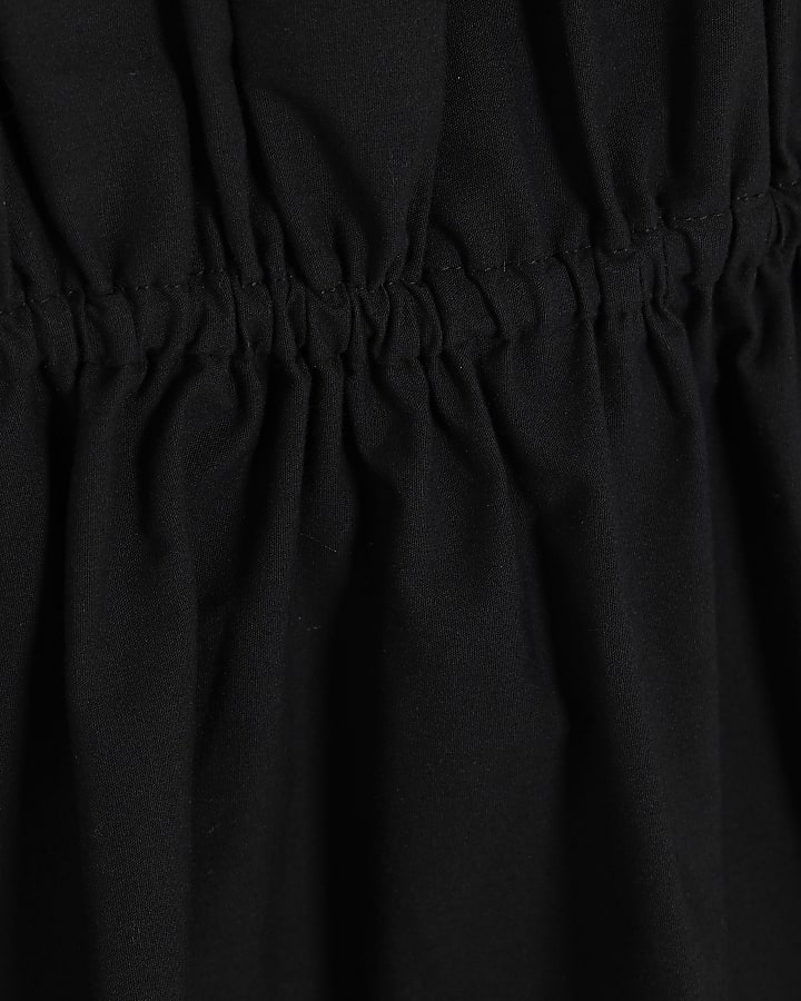 Black Tiered String Detail Peplum Top