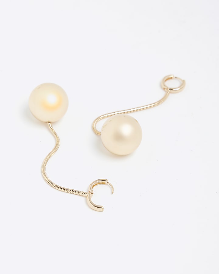 Gold long ball drop earrings