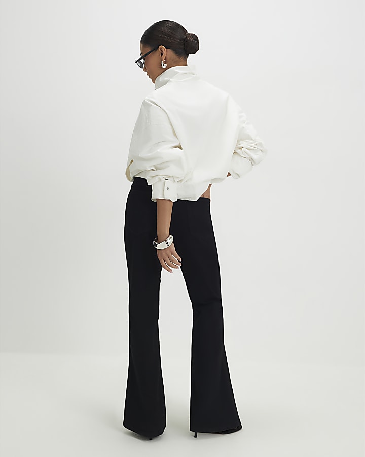 Petite Black High Rise Relaxed Flare Jeans