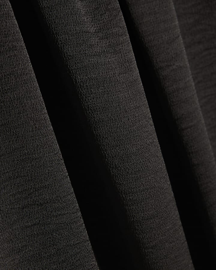 Black Sleeveless Bubble Hem Top