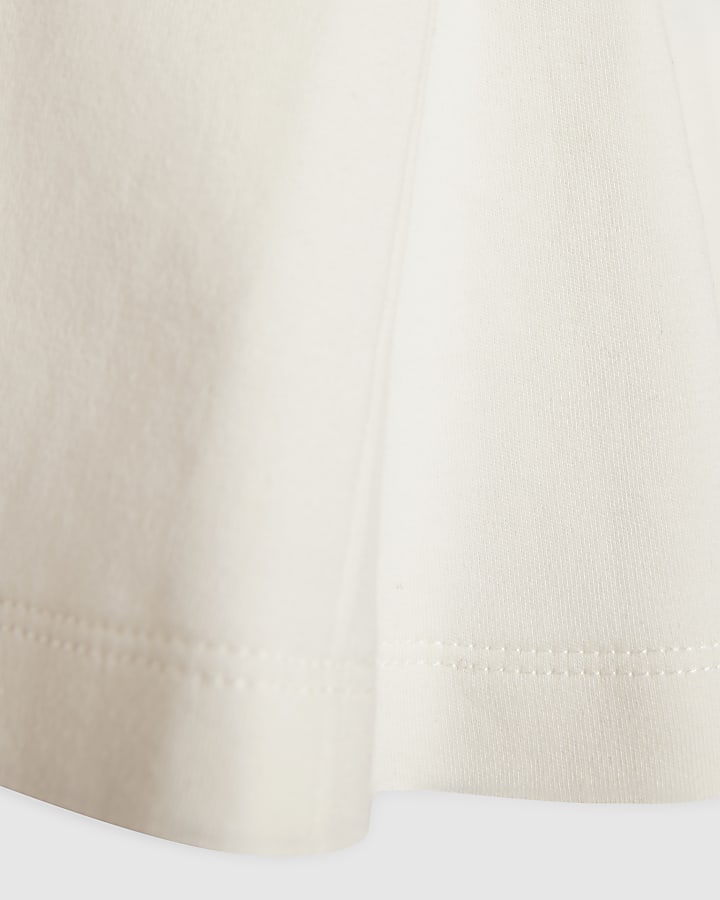 White Sleeveless Peplum Top