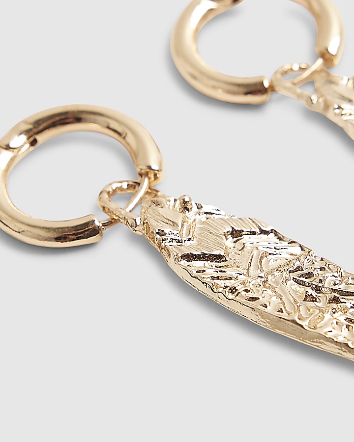Gold engraved fish earrings