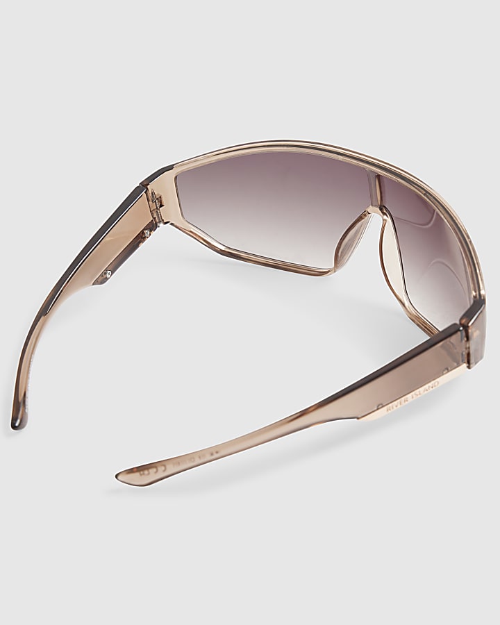 Pink wrap around visor sunglasses