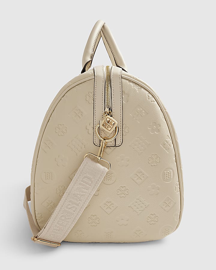 Cream Embossed Monogram Barrel Bag
