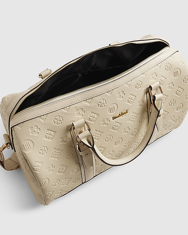Cream Embossed Monogram Barrel Bag