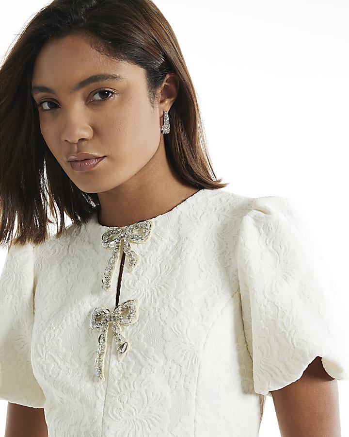 Cream Lace Embellished Bow Peplum Top