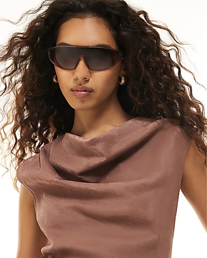 Pink wrap around visor sunglasses