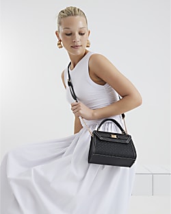 Black embossed mini top handle cross body bag River Island