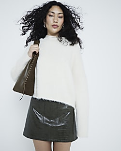Black faux leather pocket mini skirt River Island