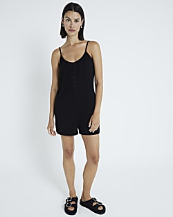Black sleeveless button detail playsuit