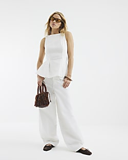 White Sleeveless Peplum Top