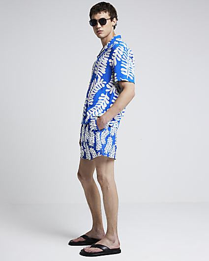 Blue regular fit tropical leaf swim shorts
