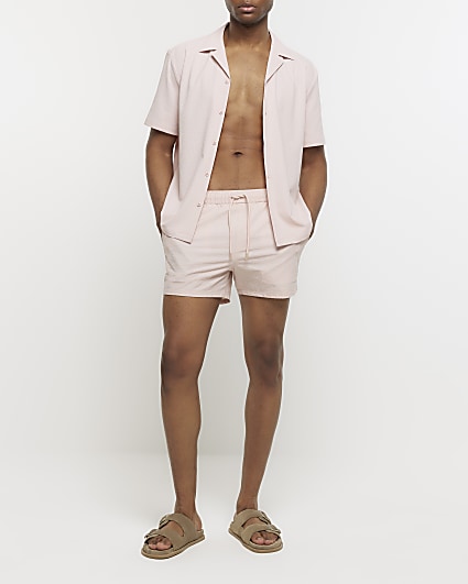 Pink regular fit seersucker swim shorts