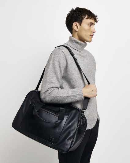 Black faux leather holdall