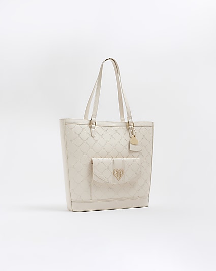 Girls cream embossed pocket shopper bag