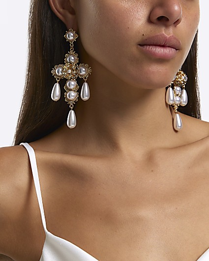Gold pearl cross drop earrings