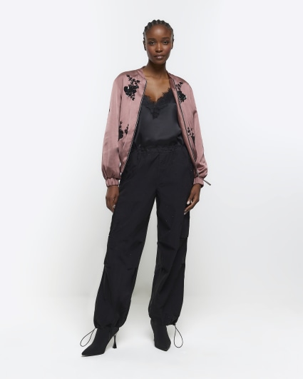 Black drawstring cuff parachute trousers