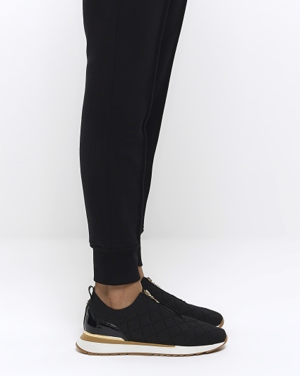 Black wide fit quilted zip trainers