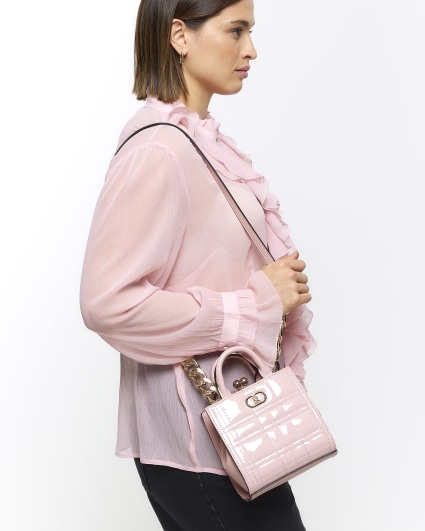 Pink quilted clip top cross body bag