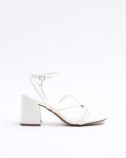 White strappy heeled sandals