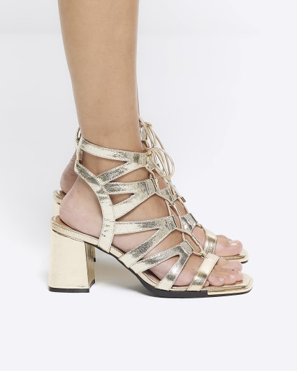 Gold strappy heeled sandals