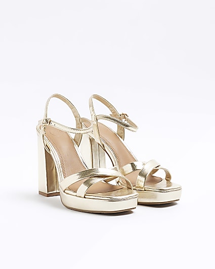 Gold crossed strap heeled sandals