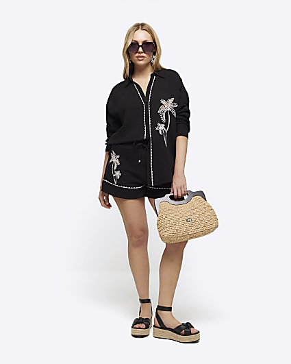 Black embroidered palm tree shorts
