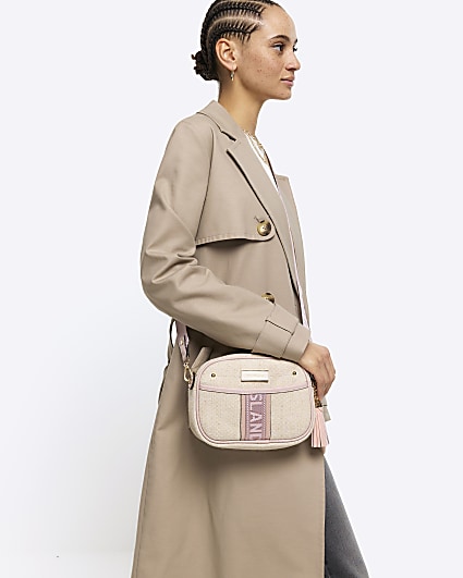 Beige canvas cross body camera bag