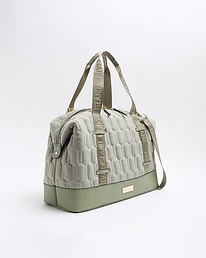 Green quilted webbing travel bag