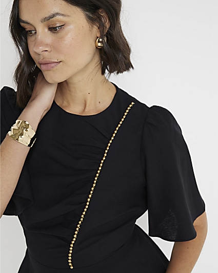 Black beaded peplum top