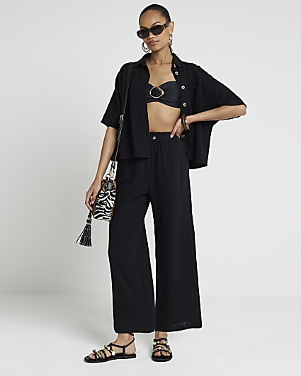 Black cropped trousers