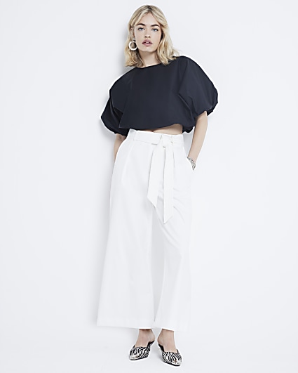 White wide leg pleated cropped trousers