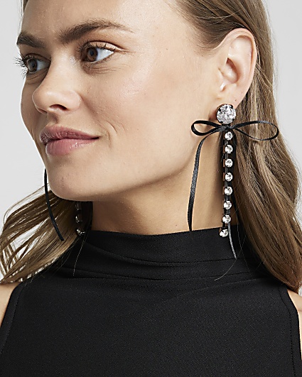 Black diamante bow drop earrings