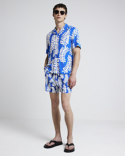 Blue regular fit tropical leaf swim shorts