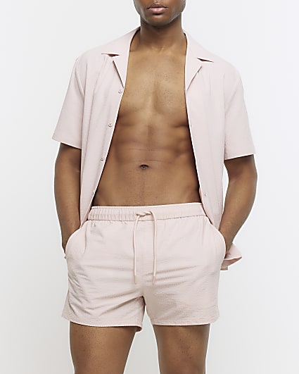 Pink regular fit seersucker swim shorts