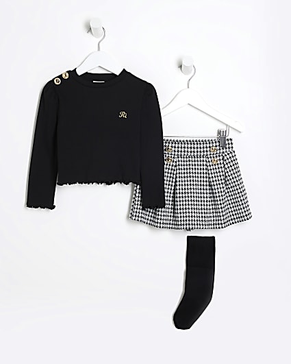 Mini girls black top and dogtooth skort set