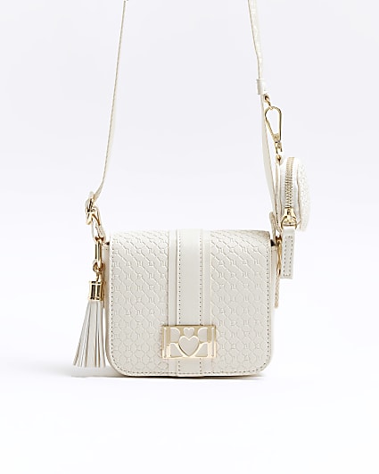 Girls cream embossed monogram cross body bag