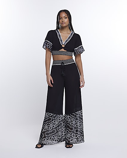 Black floral shirred wide leg trousers