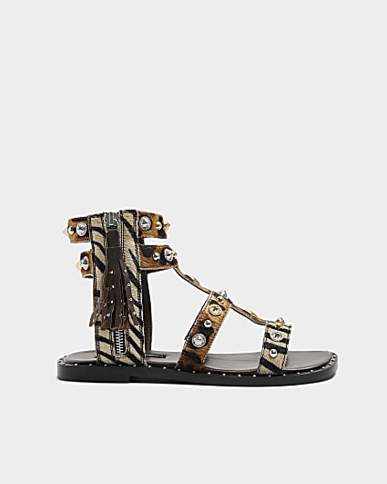 Beige leather studded gladiator sandals