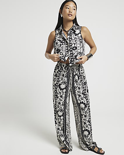 Petite black floral wide leg trousers