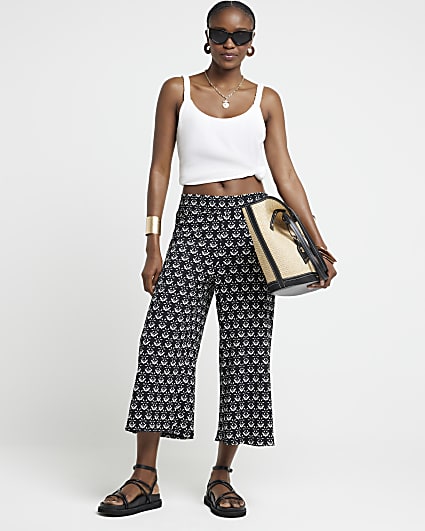 Black floral crop wide leg trousers