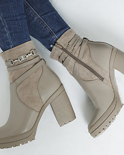 Beige hardware strap heeled boots