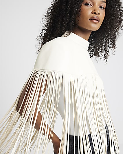 Cream faux leather tassel hem cape