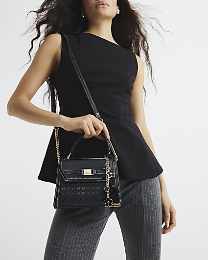 Black embossed mini top handle cross body bag