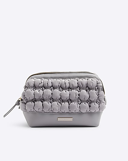 Grey quilted makeup bag