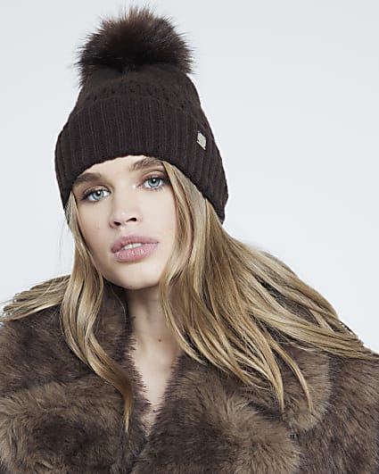 Brown pom pom cable knit beanie hat