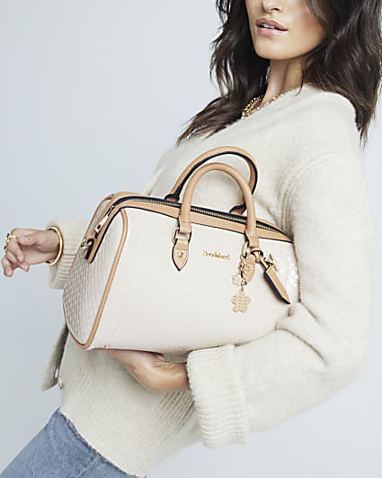 Beige embossed monogram bowler handbag