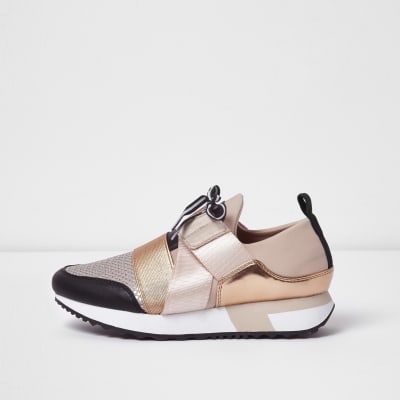 black trainers with rose gold