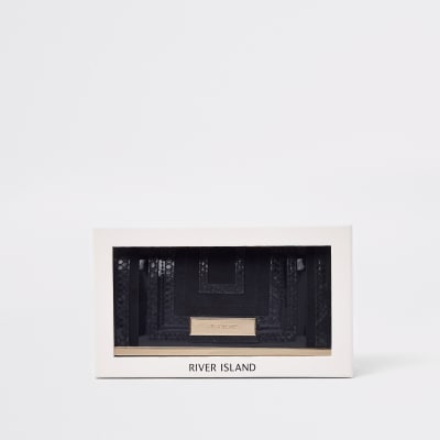 Zwarte knip met uitsnijdingen in geschenkverpakking